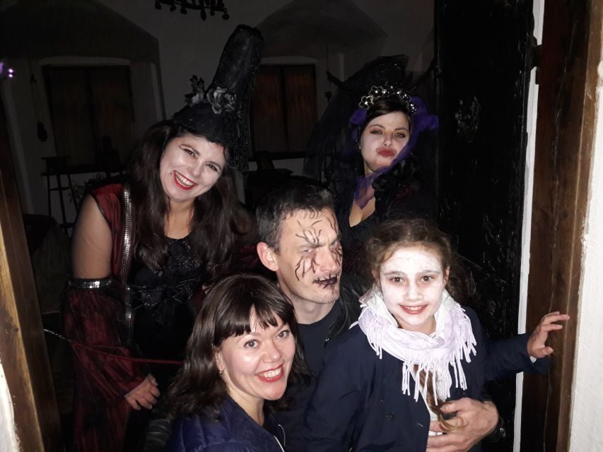 From Brasov: Halloween Party at Bran Castle - Welcome at Bran: Red Wine, Palinca, Snacks, and Group Time